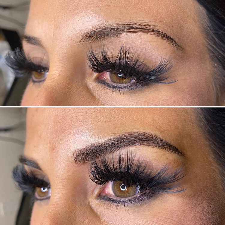 woman with big eyelashes showing her microblading results