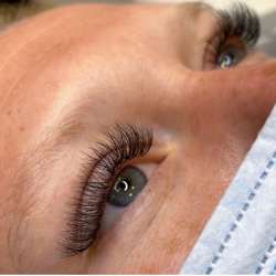 young woman showing her eyelash extensions