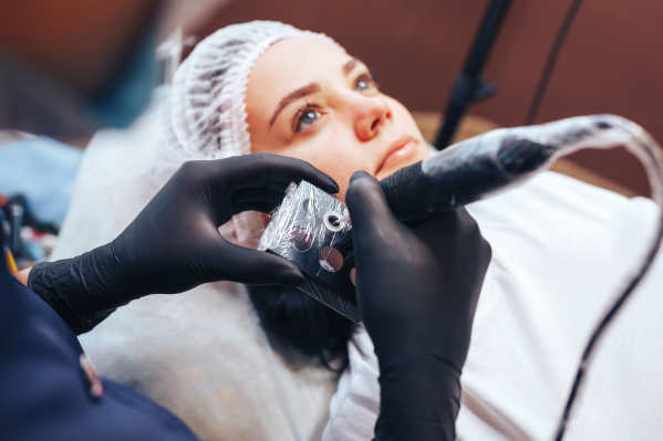 Woman getting powder eyebrows treatment