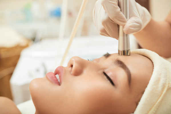woman face getting a skin treatment